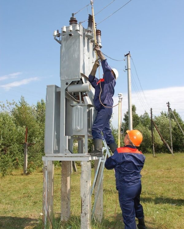 electrician-installs-ground-power-line-before-repairing-substation_271853-2196